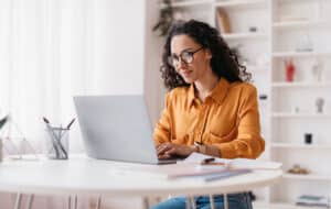 Women using medical billing software on a laptop