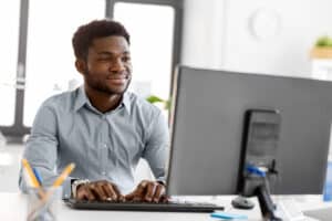 american businessman with computer working at office